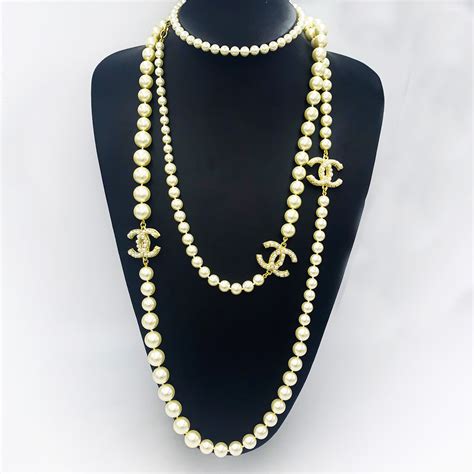 chanel pearl necklace with cc logo replica|chanel long necklace with pearls.